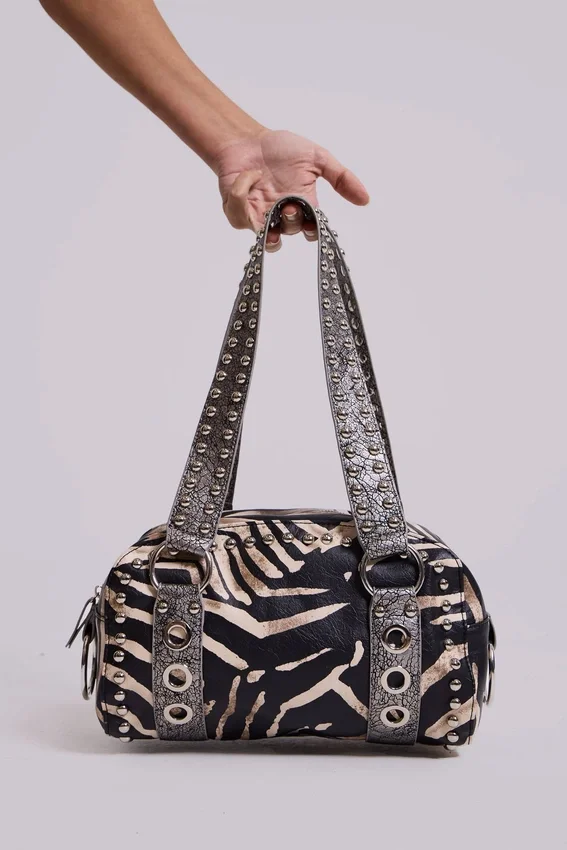 Bolso «Marza» de cuero sintético con tachuelas y estampado de cebra