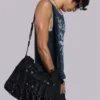 Bolso tipo cartera de denim recubierto «Drummer»