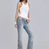 Camiseta tipo chaleco con flor de lis de strass de Rock Revival