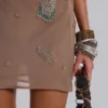 Minivestido sin espalda con adornos de Doure