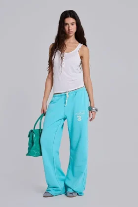 Pantalón de chándal holgado de corte acampanado Cleo en turquesa