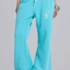 Pantalón de chándal holgado de corte acampanado Cleo en turquesa