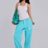 Pantalón de chándal holgado de corte acampanado Cleo en turquesa