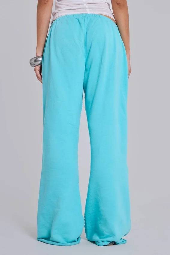 Pantalón de chándal holgado de corte acampanado Cleo en turquesa