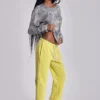 Pantalón jogger holgado de corte acampanado Cleo en color neón