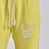 Pantalón jogger holgado de corte acampanado Cleo en color neón