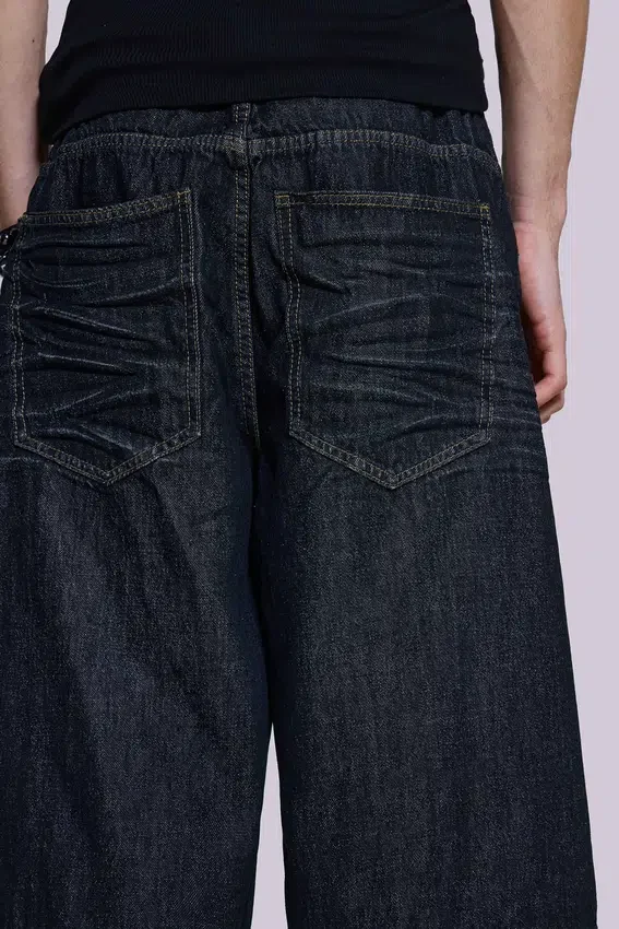 Pantalones cortos Colossus de índigo con pliegues