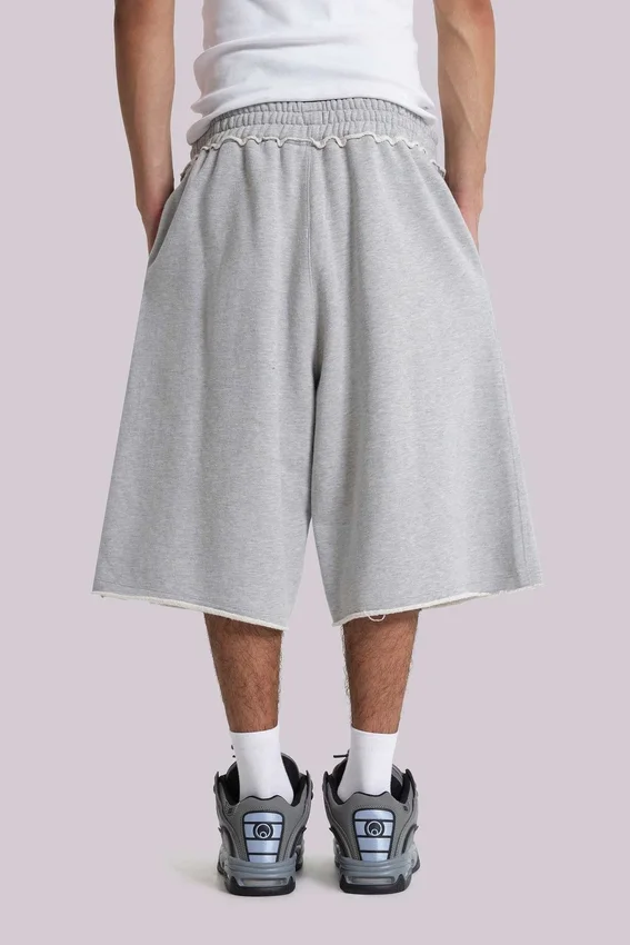 Pantalones cortos holgados tipo jogger «Monster» en gris jaspeado