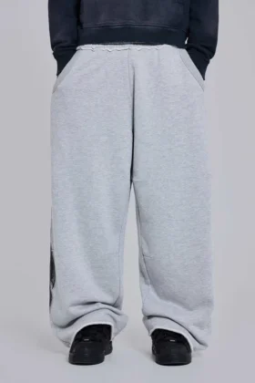 Pantalones de chándal holgados «Monster Joggers» con estampado gótico en gris jaspeado