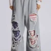 Pantalones de chándal «Monster Joggers» desgastados con estrellas y rayas