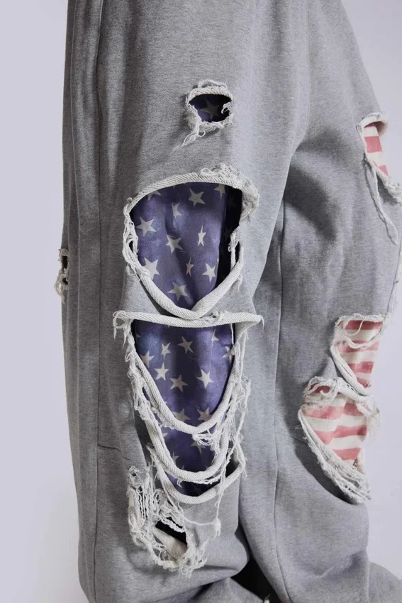 Pantalones de chándal «Monster Joggers» desgastados con estrellas y rayas