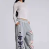 Pantalones de chándal «Monster Joggers» desgastados con estrellas y rayas