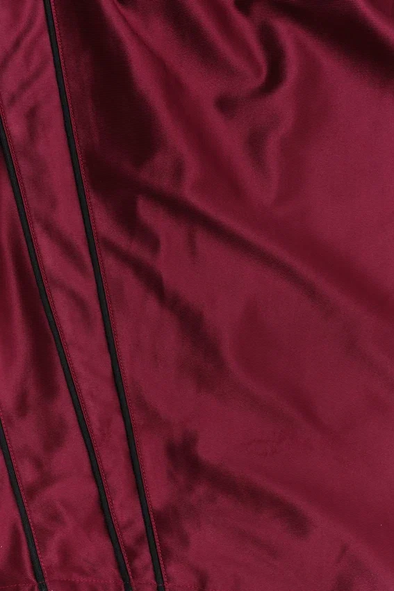 Pantalones de chándal «Vapor» metalizados en color burdeos