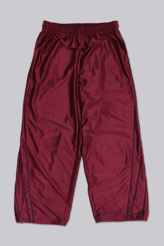 Pantalones de chándal «Vapor» metalizados en color burdeos