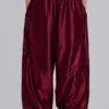 Pantalones de chándal «Vapor» metalizados en color burdeos