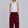 Pantalones de chándal «Vapor» metalizados en color burdeos