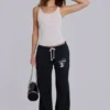 Pantalones jogger holgados de corte acampanado Cleo en negro