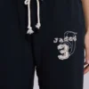 Pantalones jogger holgados de corte acampanado Cleo en negro