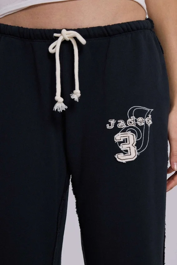 Pantalones jogger holgados de corte acampanado Cleo en negro
