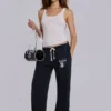 Pantalones jogger holgados de corte acampanado Cleo en negro