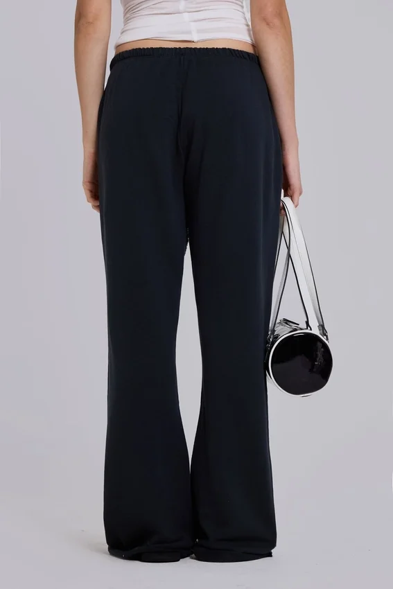 Pantalones jogger holgados de corte acampanado Cleo en negro