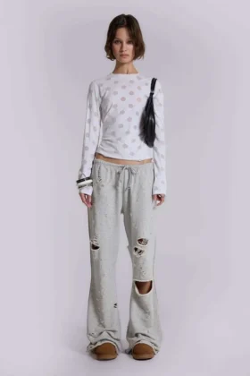 Pantalones jogger holgados de corte acampanado con efecto desgastado «Cleo»