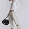 Pantalones jogger holgados de corte acampanado con efecto desgastado «Cleo»