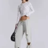 Pantalones jogger holgados de corte acampanado con efecto desgastado «Cleo»