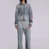 Pantalones jogger holgados de corte acampanado con estampado «Cleo»