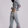 Pantalones jogger holgados de corte acampanado con estampado «Cleo»