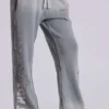 Pantalones jogger holgados de corte acampanado con estampado «Cleo»