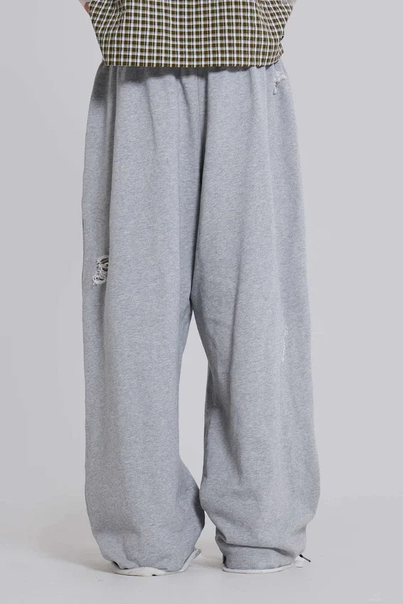 Pantalones Monster Joggers holgados en gris jaspeado desgastado