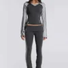 Pantalones sport «Rynna» con corte acampanado y vuelta en el bajo