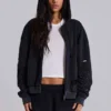Sudadera con capucha, cremallera y forro de tejido de panal, en negro lavado y efecto descolorido por el sol