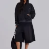 Sudadera con capucha, cremallera y forro de tejido de panal, en negro lavado y efecto descolorido por el sol