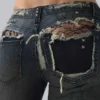 Vaqueros bootcut de talle bajo con encaje desgastado «Tori»