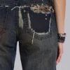 Vaqueros bootcut de talle bajo con encaje desgastado «Tori»