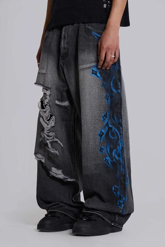 Vaqueros negros Colossus Jeans XL con rotos y diseño «Spike Airbrush»