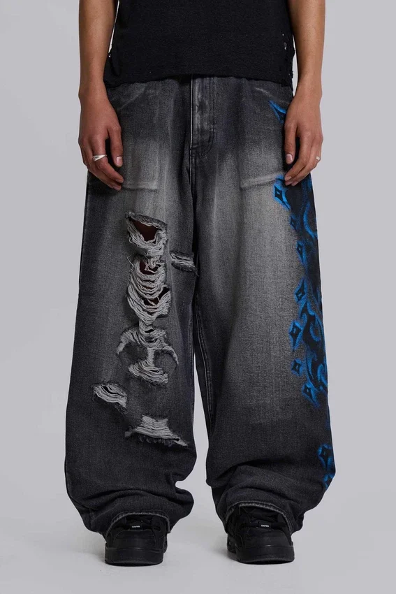 Vaqueros negros Colossus Jeans XL con rotos y diseño «Spike Airbrush»