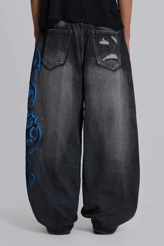 Vaqueros negros Colossus Jeans XL con rotos y diseño «Spike Airbrush»