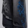 Vaqueros negros Colossus Jeans XL con rotos y diseño «Spike Airbrush»