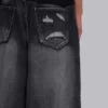 Vaqueros negros Colossus Jeans XL con rotos y diseño «Spike Airbrush»
