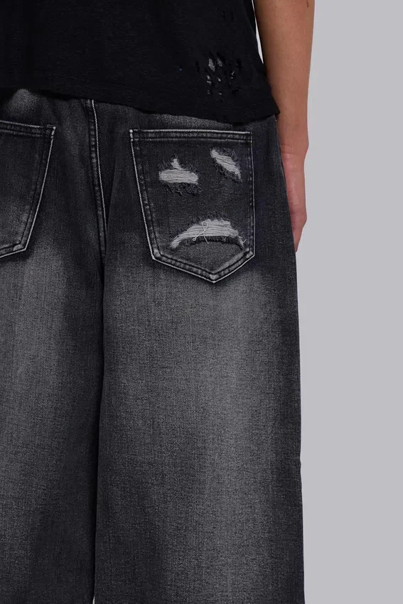 Vaqueros negros Colossus Jeans XL con rotos y diseño «Spike Airbrush»